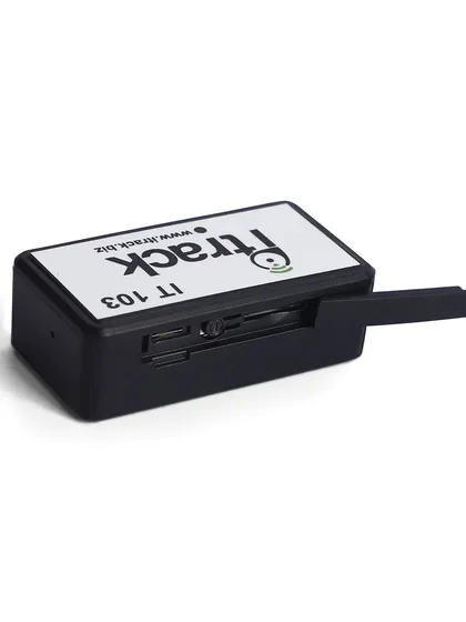 A shot of the GPS tracker with its side port cover open, revealing the internal slots. This functional detail is vital for customer understanding.