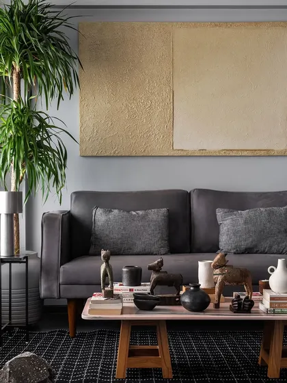 This living room setting shows a sofa I designed for comfort and style. Paired with a custom coffee table, it creates a welcoming space for family and guests to gather.