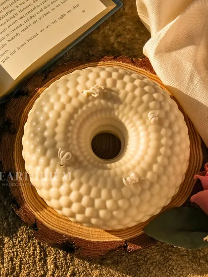 My 'Ethereal Halo Candle' is a large, circular statement piece with a beautiful textured design. It creates a serene and tranquil glow.