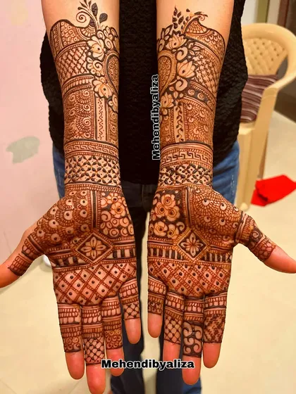 A beautiful design for the bride's side, with intricate patterns and motifs that complement the main bridal henna.
