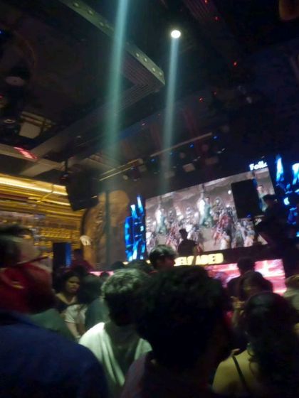 Spotlights cut through the haze at Sugar Factory, with my visuals playing on the screen. It's a full production every time.