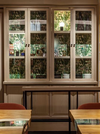 A glimpse into our retail cabinet, where you can find some of our house-made products and other curated items to take home.