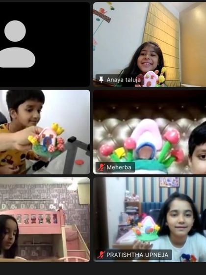 A screenshot from our "fun clay day" online workshop. It's wonderful to see so many happy faces and their colorful miniature clay houses.