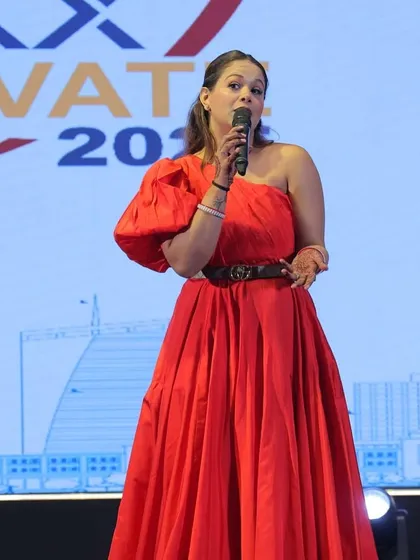 Dressed in red for the ROXX ELEVATE 2025 gala. I believe in not just hosting an event, but becoming a part of its story and vision.