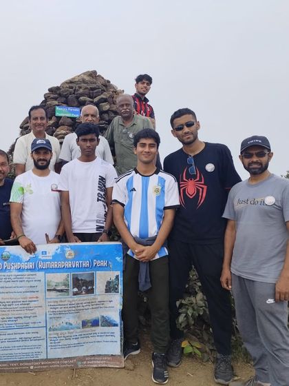 A diverse group of trekkers, young and old, at the Kumara Parvatha peak. This trek is a challenge that brings people together.