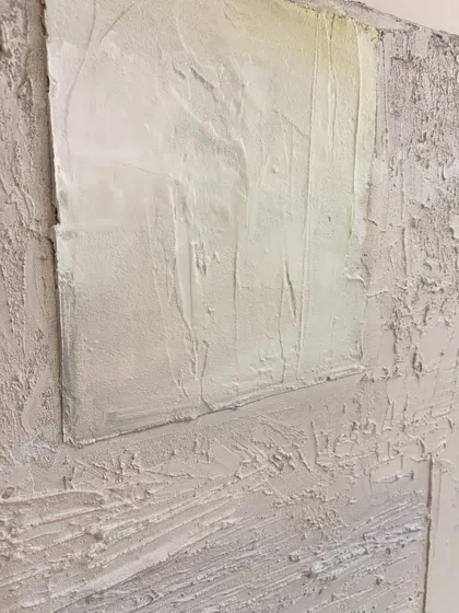 Another detail shot of the Houston commission, highlighting the layered effect of the texture work. The neutral color palette allows the sculptural quality of the piece to be the main focus.