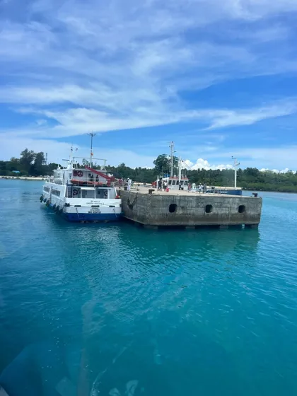 My travels go beyond the ghats. Here's a shot from our Andaman trip, with a ferry docked in the crystal-clear blue waters. Whether it's scuba diving in the ocean or trekking in the mountains, I can plan a custom trip for your group anywhere.