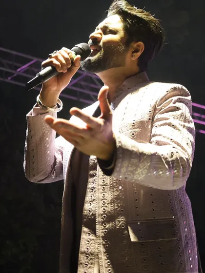 'Music is the soundtrack of your life.' A close-up shot from a live performance, capturing the emotion in the song.