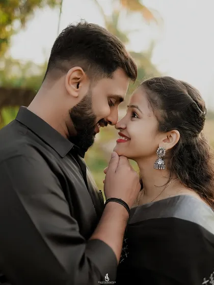 A beautiful close-up capturing their gentle connection. The traditional silver jhumkas add a lovely detail.