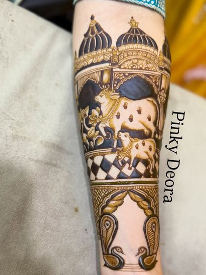 A detailed forearm design depicting Shreenathji in his temple with his sacred cows. The checkered floor and architectural details add depth and realism to the scene.