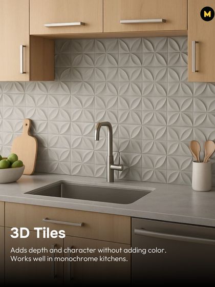 3D tiles are a great way to add depth and character without adding color. These white tiles with a floral-inspired pattern create a subtle yet impactful backsplash in this monochrome kitchen.