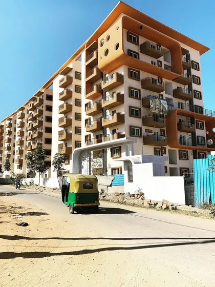 This multi-storied apartment building in Bangalore demonstrates our capability in large-scale residential architecture. The design focuses on creating unique, functional balconies and a visually interesting facade that breaks the monotony of a large structure.