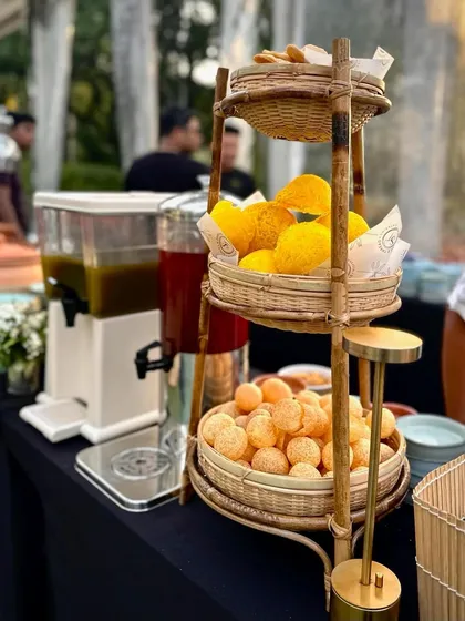 Our elegant pani puri station, featuring dispensers of flavored water and baskets of puris. The setup is both functional and aesthetically pleasing, fitting seamlessly into any event decor.