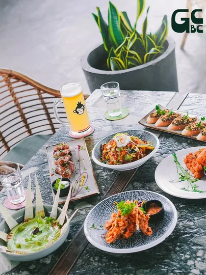 A table laden with our best offerings. From Mediterranean dips and crispy appetizers to grilled skewers and craft beer, there's something for every palate.