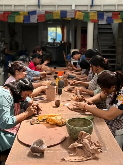 Welcome to my studio, a place where creativity and community come together. This is a glimpse from a team building retreat, where everyone is lost in the moment, shaping clay and making memories.