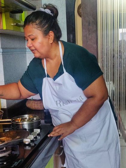 In my kitchen, doing what I love. I offer various experiences, from meal boxes to private cooking classes, to celebrate the love of food.