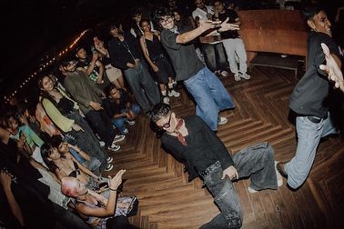 A fisheye view capturing the chaos and fun of our club performance. This is the "maza aagya" moment we aim for at every party.