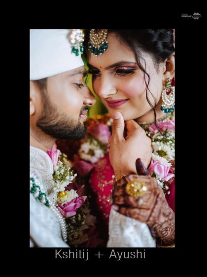 An intimate close-up of the couple. This shot focuses on their emotional connection, with the groom's hand gently caressing the bride's face, a testament to their love.