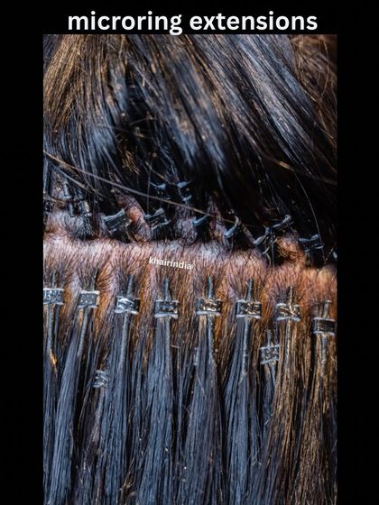 A close-up view of our micro-ring extensions. The rings are small and discreet, ensuring that the extensions blend seamlessly and comfortably with your natural hair.
