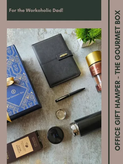 For the workaholic dad who has everything, I created this sleek office gift hamper. It combines practical items like a professional diary, pen, and a thermal flask with gourmet coffee and dark chocolate for that much-needed break. It's a functional gift that still feels like a treat.