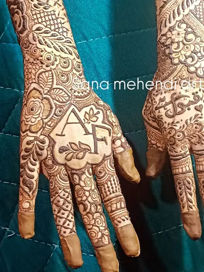 Simple and elegant, this design features the couple's initials 'A' and 'F' in a beautiful floral crest. It's a subtle yet meaningful way to add a personal touch.