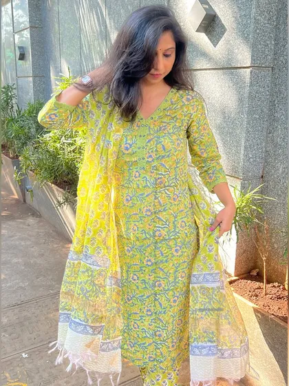 A still shot of the lime green printed dupatta set. The soft cotton and cheerful print make it an ideal choice for your festive or daily wear wardrobe.