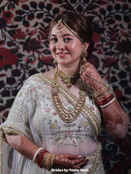 A smiling portrait that captures the joy of the day. The makeup is designed to look fresh and natural, enhancing her features without feeling heavy.