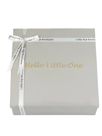 A clean, e-commerce shot of a 'Hello Little One' gift box, tied with a branded ribbon. This focuses on the premium packaging.
