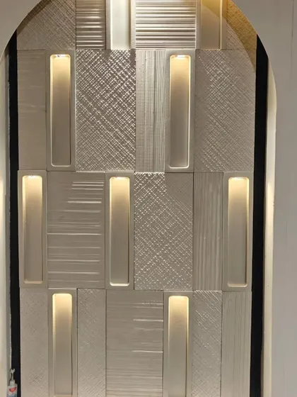 This stunning wall cladding combines textured panels with integrated, concealed lighting. The result is a sophisticated feature that provides both visual interest and ambient light.