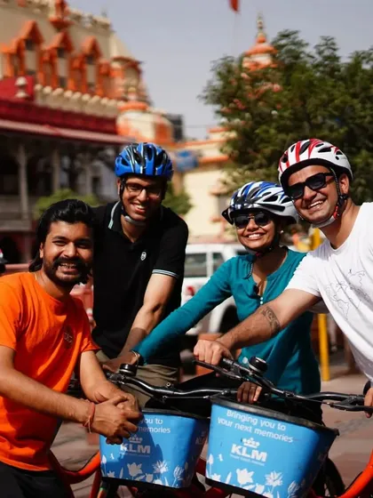 Our guide shares a happy moment with a group of riders in front of a temple in Old Delhi. We pride ourselves on creating a friendly and welcoming atmosphere for everyone.