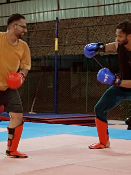 A light-hearted moment during a kickboxing drill. Training should be tough, but it's also about enjoying the process with your tribe.