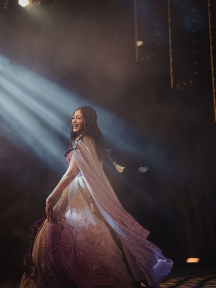 A dramatic shot of Surabhi on the dance floor. The makeup is designed to be long-lasting and radiant, even under spotlights.