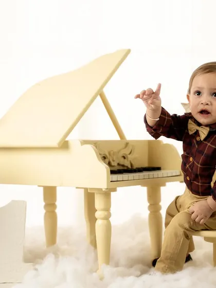 An expressive moment of storytelling. This little one looks like he's conducting his own symphony.