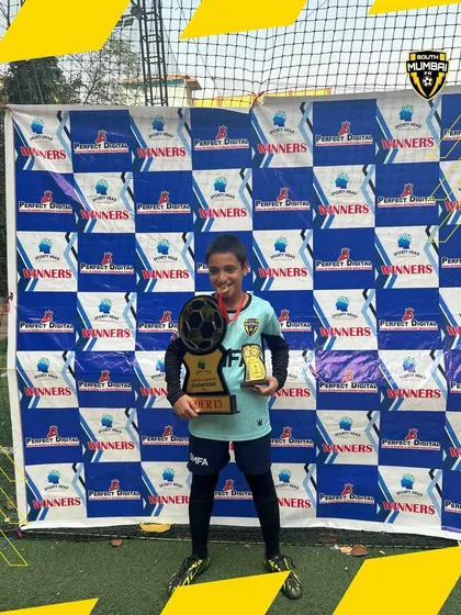 Kayan Kerawalla, our U13 Best Goalkeeper, with his well-earned trophy. Specialized goalkeeper training is a key part of our program.