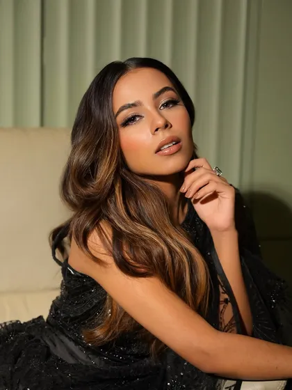 A close-up portrait that captures the intensity of this glam look. The soft smokey eye and perfectly sculpted features create a captivating and high-fashion feel.