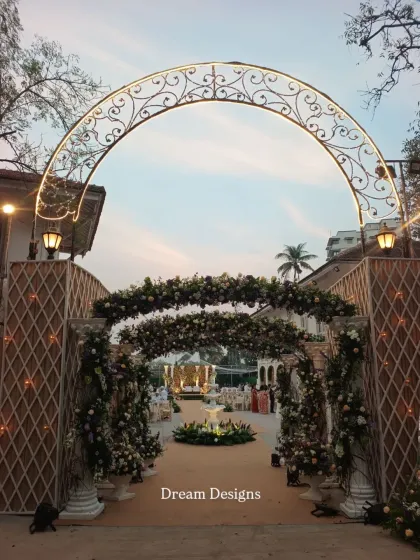Your guests' experience begins the moment they arrive. I crafted this grand entrance with a wrought-iron arch and lush floral arrangements to set a tone of classic elegance and welcome everyone into a beautifully styled celebration.