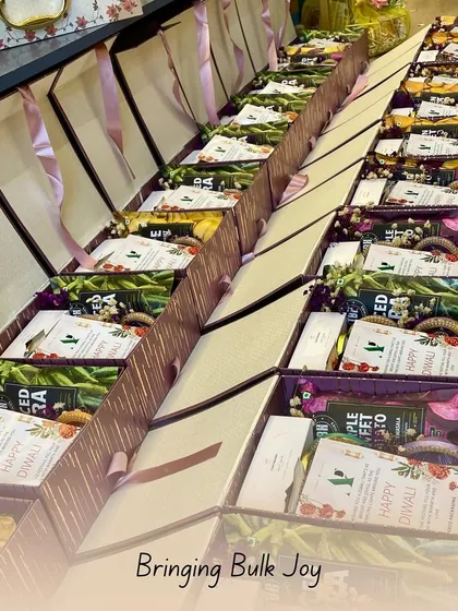 Bringing bulk joy, one hamper at a time. This image shows rows of festive Diwali hampers being prepared, showcasing my capacity to handle large corporate and personal orders while maintaining quality.
