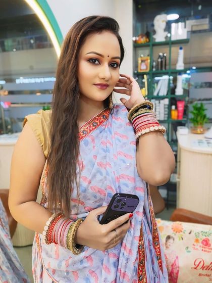 A full view of the client in her saree, looking confident and ready for her event.