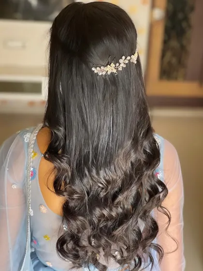 The back view of the Roka hairstyle, with a delicate hair accessory.