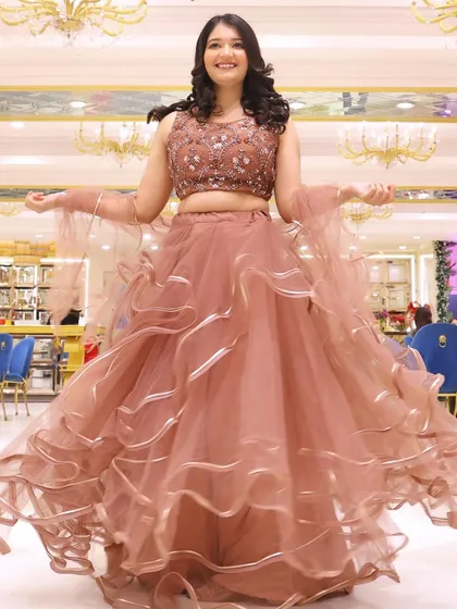 A twirl to show off the beautiful ruffled skirt. The makeup is designed to be flawless from every angle.