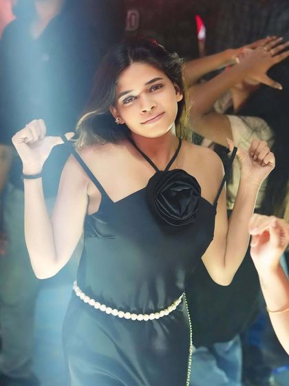 A guest dancing in the spotlight. I make sure everyone feels like a star on my dance floor.