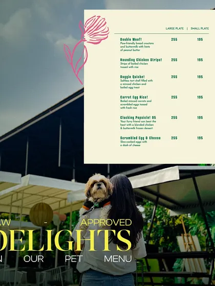 We have paw-approved delights on our special pet menu. This image shows a guest holding her pup while looking at the menu options available for her furry friend.