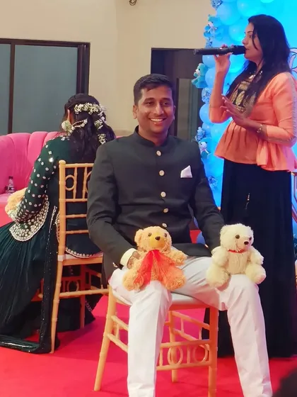 The dad-to-be is always a sport. Here he is, participating in a fun game with teddy bears, bringing so much laughter to his own baby shower celebration.