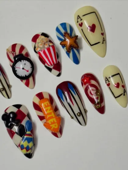 Feeling lucky? This casino themed set is all about high stakes and high fashion. I went all out with 3D details like a tiny popcorn bucket, a clock, and playing cards. It's a bold, maximalist design for when you want your nails to do all the talking.