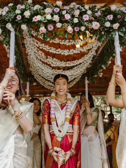 A bride's entrance should be nothing short of magical. For this South Indian wedding, we designed a breathtaking 'Phoolon ki Chadar' or floral canopy, creating a dreamy pathway for the bride as she was escorted by her loved ones.