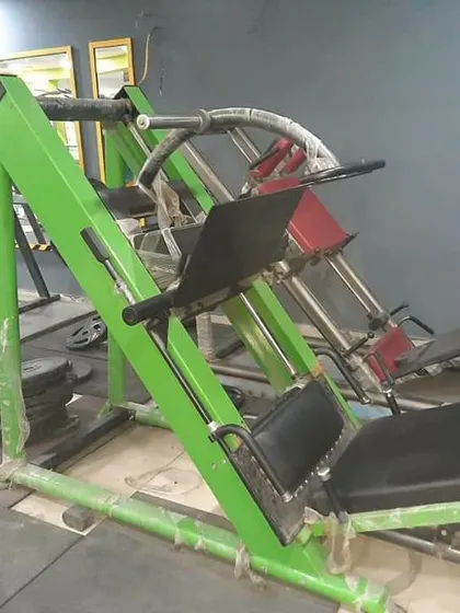 A close-up of our heavy-duty leg press and hack squat machines. This equipment is essential for anyone serious about building powerful legs and is a core part of our strength training setup.