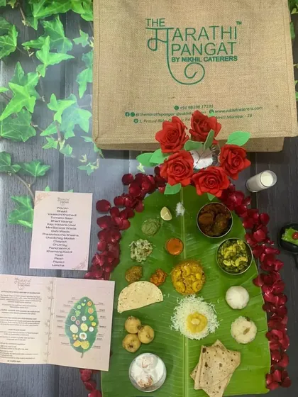 Here is a look at the complete package. Your meal arrives in our custom jute bag, complete with fresh banana leaves, a detailed menu, our serving guide, and even a DIY decor kit with flowers to make your celebration special.