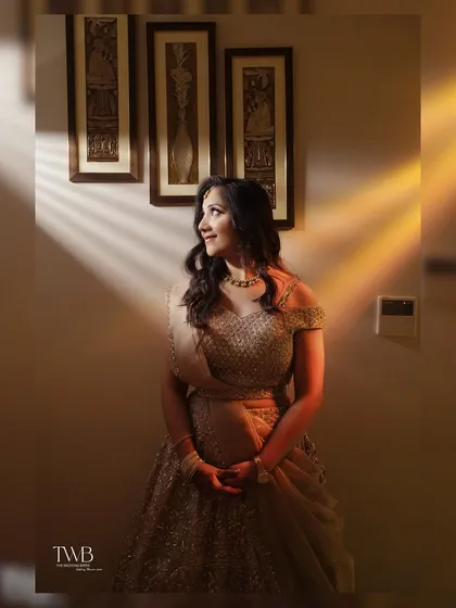 An artistic portrait of the bride-to-be. The creative use of light and shadow adds a dramatic and beautiful effect, highlighting her features and elegant gown.