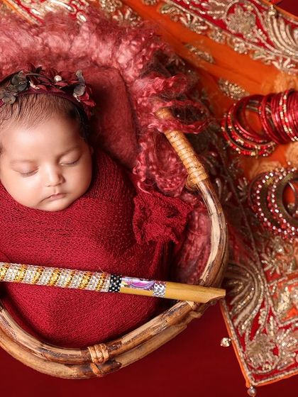 Wrapped in love and surrounded by traditions. This setup, complete with dandiya sticks and bangles, celebrates culture and the newest addition to the family.