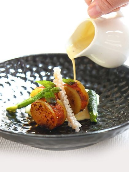 A delightful blend of tender jackfruit and creamy sweet potato podimas, served in a rich, spiced coconut curry. This comforting dish is a perfect example of our inventive vegetarian offerings.